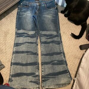 no boundaries flare jeans with zebra print on the bottoms of the legs.